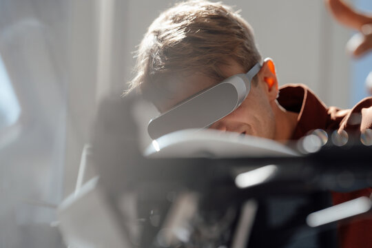 Businessman wearing wearing virtual reality simulator in office