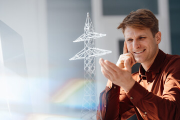 Smiling engineer analyzing at electricity pylon model in office
