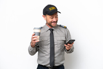 Middle age security man isolated on white background holding coffee to take away and a mobile