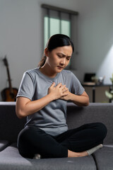 Asian woman was sick with chest pain.