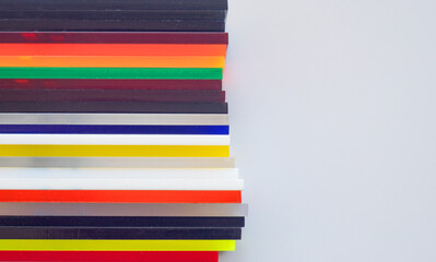 Plastic parts of different colors. Sale of multicolored plastic. Color matching on a plastic product in the store.