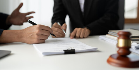 Businessman and lawyer discuss the contract document. Treaty of the law. Sign a contract business.