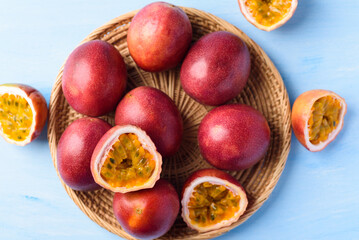 Obraz premium Passion fruit from local market on blue background, Tropical fruit in spring and summer season