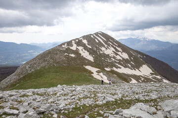 two hikers reach the top of Monte Alpi. Monte Santa Croce, Pizzo Falcone, Lucan Apennines, Basilicata, Italy