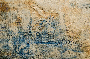 Abstract background stone wall texture in ethnic style with seashell or gravel traces as a retro pattern layout.It is a conceptual or metaphor wall banner, grunge, material, aged or construction.