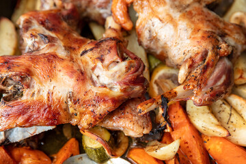 Lamb leg with bone baked with potato and herb in oven. Traditional Greek Easter food. Close up view.