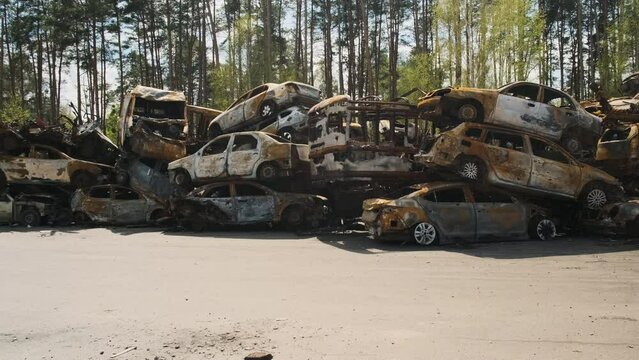 Irpin, a lot of burnt shelled cars in the parking lot, the consequences of the invasion of the Russian army in Ukraine. War in Ukraine