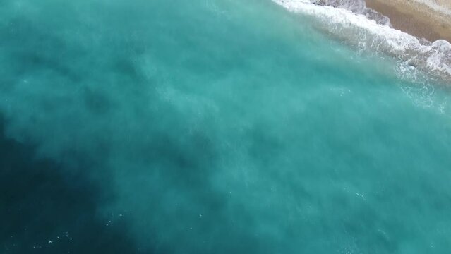 A flight over the blue sea flying to the village beach. High quality FullHD footage