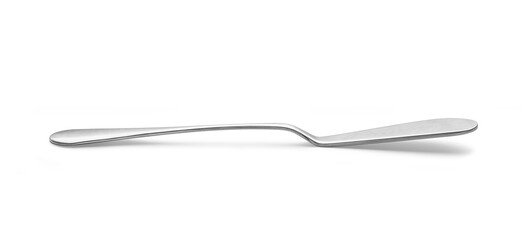 Knife spreads butter and jam on white background.