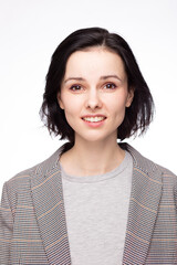 emotional woman in a gray t-shirt and jacket, white background