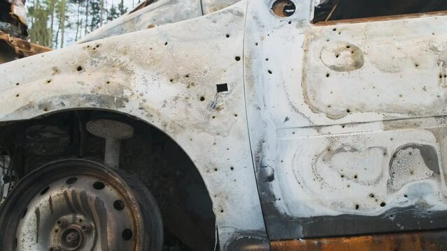 Irpin, Rusty burnt shelled cars, the consequences of the invasion of the Russian army in Ukraine. War in Ukraine