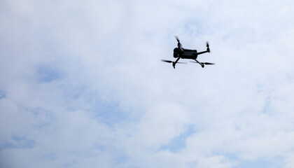 Drone flying in spring forest