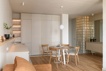 modern beige kitchen interior with kitchen accessories, loft style kitchen interior, apartment with open plan