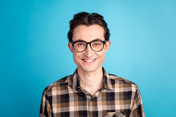 Photo of young cheerful guy good mood smart toothy smile banker marketer isolated over blue color background