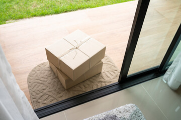 Deliver parcels box on door mat near home entrance door