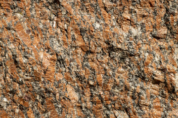 Granite surface texture in bright sunlight close up