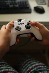 in the hands of a child, a game console
