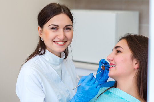 Woman having teeth examined at dentists.