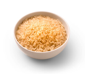 porcelain bowl with raw oriental rice, with light shadow in the background
