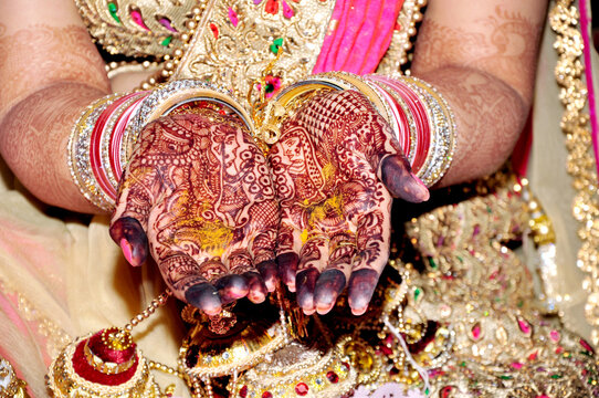 Indian bride showing mehndi tattoos design