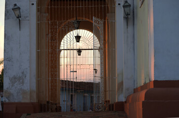 The entrance gate to the church of Santissima Trinidad at sunset, Cuba