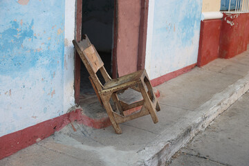 Chair outside the door in the city of Trinidad, Cuba
