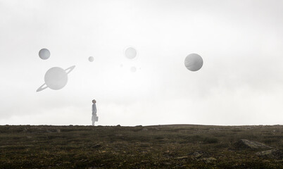 Back view of young businessman while standing with mist background