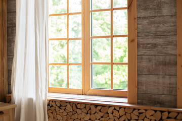 Big wooden window with frame and window sill and nature on background. Empty room, wooden window...