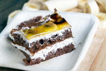 a piece of banana cake and fresh sliced bananas