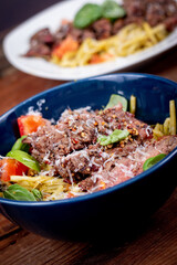 Grilled flank steak over basil pesto keto pasta