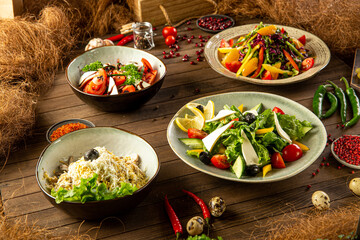 Variation of different georgian appetizers and salads on wooden table