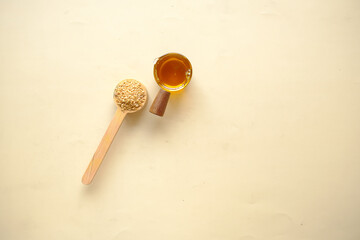 sunflower coking oil and seeds in a container on table 