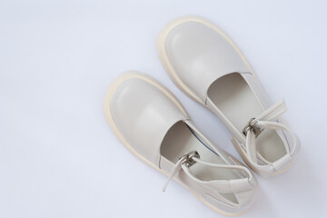 Women's shoes with massive soles. Mary Jane shoes. Beige shoes with modern thick soles. Modern fashion trend. View from above