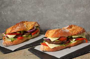 Burger with Baguette Bread on the wooden table