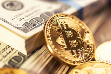Gold Bitcoins on American Banknotes. Online trading between US currency and cryptocurrency.