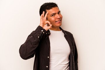 Young hispanic man isolated on white background cheerful and confident showing ok gesture.