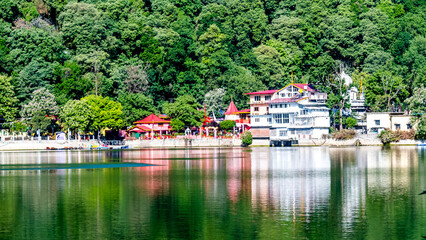Fototapeta na wymiar View of Nainital Lake, Naina Devi Temple and mountains are in the background, Nainital, Uttarakhand, India