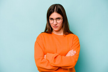 Fototapeta premium Young caucasian woman isolated on blue background unhappy looking in camera with sarcastic expression.