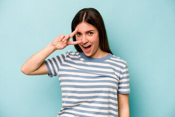 Fototapeta premium Young caucasian woman isolated on blue background dancing and having fun.