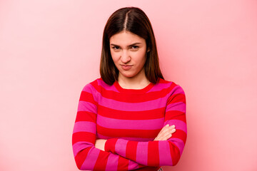 Fototapeta premium Young caucasian woman isolated on pink background unhappy looking in camera with sarcastic expression.