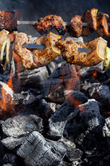 barbecue with cooking meat on the fire