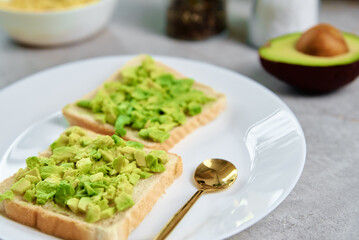 Toasts with avocado on white plate, Healthy food and dieting concept, Organic product