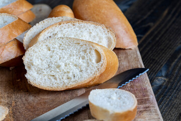 wheat baguette cut into pieces on a cutting board