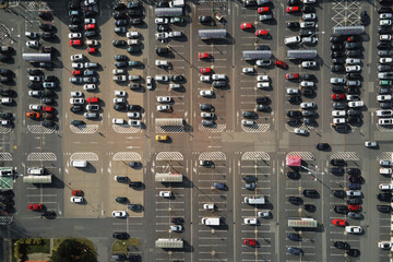 Aerial view of parking lot near shopping mall, Top view of parked cars on parking spots, City transport