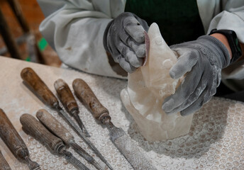 Working on alabaster sculpture.