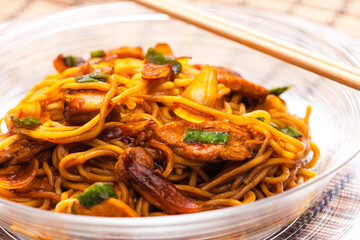 fried noodles with chicken meat in soya sauce