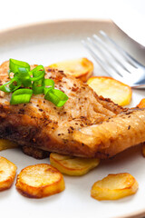 carp on cumin with fried potatoes