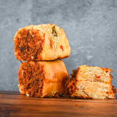 Indonesian snack, Roti gulung abon ikan tuna or Shredded tuna roll on a white folding plate.