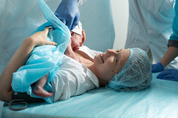 Mother look to her newborn baby in hospital