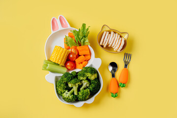 Cute plate in the shape of a bunny with  fresh vegetables. Food idea for kids. Children's healthy...